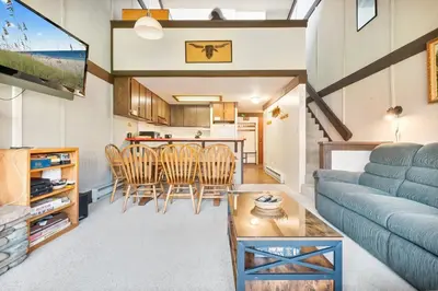 a living room with a couch and a table at Relaxing, Well Furnished Condo! - Creekside #29 in Bear Valley