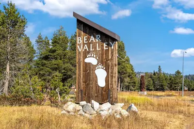 a sign for a bear valley in a field at Modern & Sleek Condo - Creekside #110 in Bear Valley