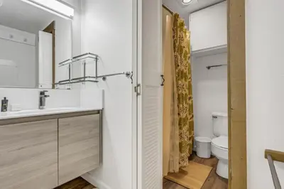 a bathroom with a sink and a toilet at Modern & Sleek Condo - Creekside #110 in Bear Valley