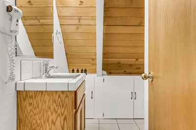 a bathroom with a sink and white cabinets at Multi-Family Cabin in Great Location #183 in Bear Valley