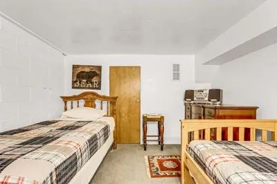 a bedroom with two beds and a refrigerator at Multi-Family Cabin in Great Location #183 in Bear Valley