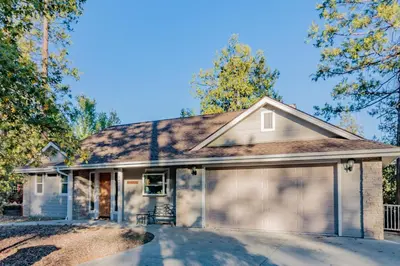 a house with a garage at Murray Lake Retreat in Bass Lake