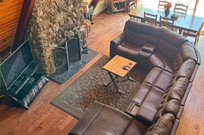 an overhead view of a living room with a couch and a fireplace at Alford Family Lodge in Bass Lake