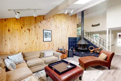 a living room with a couch and a fireplace at Todds Lakefront House in Bass Lake