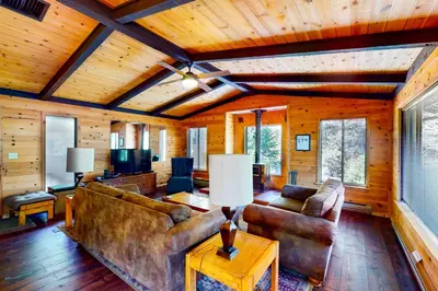 a living room with a couch and a table at Yosemite Big Rock Cabin in Fish Camp