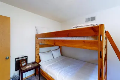 a bedroom with two bunk beds in a room at Yosemite Big Rock Cabin in Fish Camp