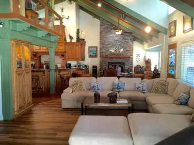 a living room with a couch and a table at Knott Lakeview in Bass Lake