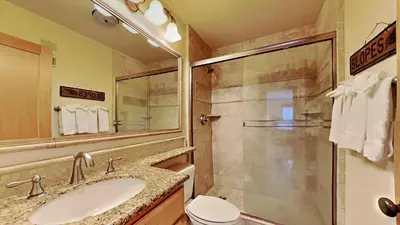 a bathroom with a sink and a shower at Spacious One Bedroom Condo in Mammoth! Free Assigned Parking - Snowbird 107 in Mammoth Lakes