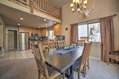 a dining room and kitchen with a table and chairs at Great for Groups Soda Springs Cabin with Deck! in Soda Springs