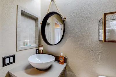 a bathroom with a white sink and a mirror at Snowcreek 625 in Mammoth Lakes