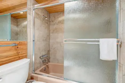 a bathroom with a shower with a glass door at Lake Lookout in Stateline
