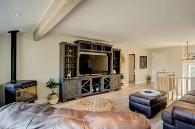 a living room with a couch and a tv at Lake Lookout in Stateline