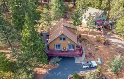 an aerial view of a house on a lake at Bearvista in Arnold