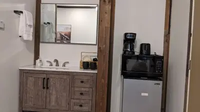 a small kitchen with a sink and a microwave at Clingan's Junction Cottage #4 in Squaw Valley