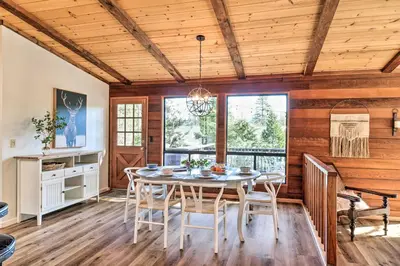 a dining room with a table and chairs at Groveland Cabin with Outdoor Perks and Game Room in Groveland
