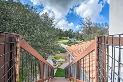 a wooden walkway leading up to a house at Romantic Treetop Studio 30 Mi to Yosemite! in Coarsegold