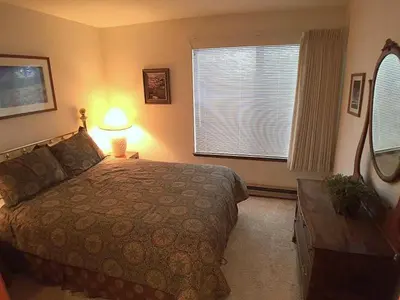 a bedroom with a large bed and a window at Standard Condos with Free Parking in Mammoth Lakes