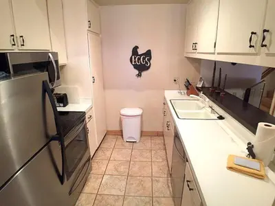 a kitchen with a sink and a refrigerator at 2 Bedrooms Premium Condos in Mammoth Lakes