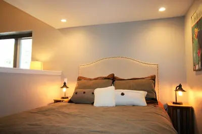 a bedroom with a large bed with two pillows at Mammoth Estates Condo - Free Parking & Pet Friendly in Mammoth Lakes