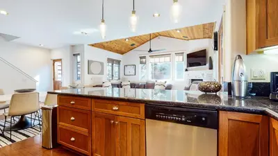 a kitchen with wooden cabinets and a counter top at Grayfox 2 Pet-Friendly, 5-Star with Private Hot Tub, 2 Car Garage and Prime Location condo in Mammoth Lakes