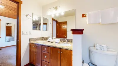 a bathroom with two sinks and a toilet at Grayfox 2 Pet-Friendly, 5-Star with Private Hot Tub, 2 Car Garage and Prime Location condo in Mammoth Lakes