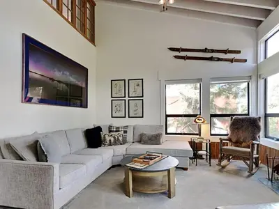 a living room with a couch and a table at Summer Fun - SLOPESIDE 4BR 3BA with 3 Spas, Pool and Sauna - Perfect for Family and Friend Getaways All Year Round 1849 Condos 693 condo in Mammoth Lakes