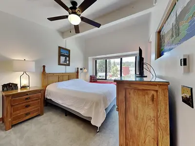 a bedroom with a bed and a ceiling fan at Summer Fun - SLOPESIDE 4BR 3BA with 3 Spas, Pool and Sauna - Perfect for Family and Friend Getaways All Year Round 1849 Condos 693 condo in Mammoth Lakes