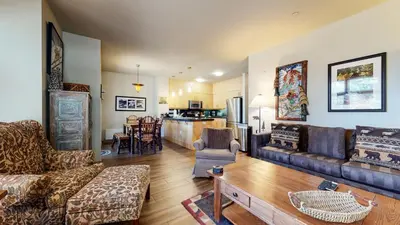 a living room with a couch and a table at Solstice 11 Amazing Location on Golf Course, Heated Garage, Private Washer Dryer condo in Mammoth Lakes