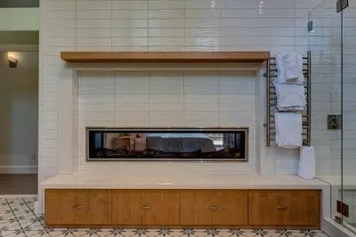 a bathroom with a fireplace in the wall at Mountain & Lake-View Delight in Truckee