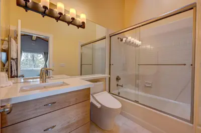 a bathroom with a toilet and a sink and a shower at Mountain & Lake-View Delight in Truckee