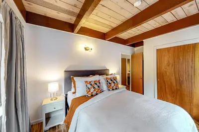 a bedroom with a bed and a wooden ceiling at Hidden Haven in Arnold