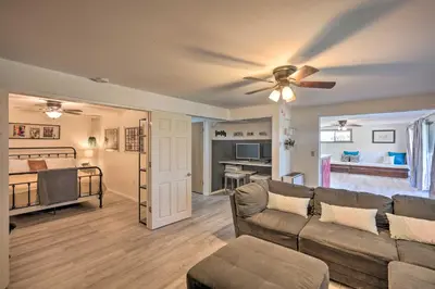 a living room with a couch and a ceiling fan at Jackson Escape with Hot Tub and Mtn Views! in Jackson