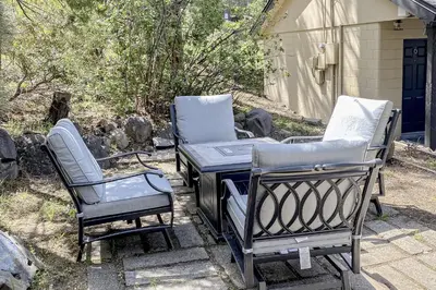 a couple of chairs and a grill on a patio at The Chalet at Kings Beach Unit 1 in Kings Beach