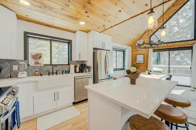 a kitchen with a white counter top and wooden ceilings at Bolzano's Getaway in Truckee
