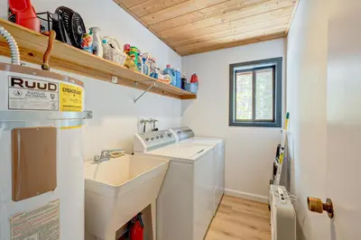 a kitchen with a sink and a washing machine at Bolzano's Getaway in Truckee