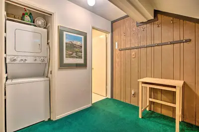 a small room with a refrigerator and a table at Mammoth Lakes Townhome Less Than 2 Mi to Ski Area! in Mammoth Lakes
