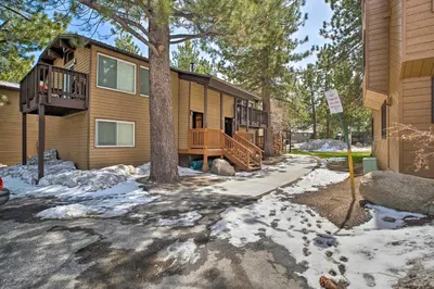 a house with snow on the ground in front of it at Mammoth Lakes Townhome Less Than 2 Mi to Ski Area! in Mammoth Lakes
