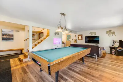 a living room with a pool table in it at Paws Place in Arnold