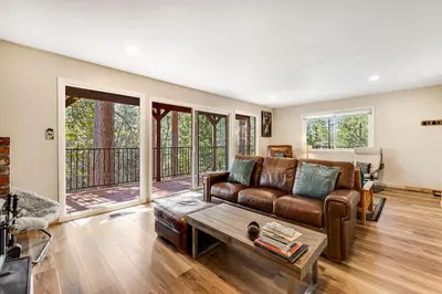 a living room with a couch and a table at Paws Place in Arnold