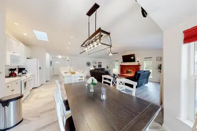 a kitchen and living room with a table and a dining room at The 19th Hole in Groveland