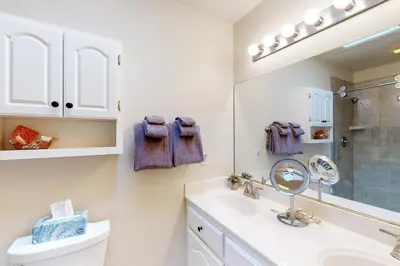 a bathroom with a sink and a mirror at The 19th Hole in Groveland