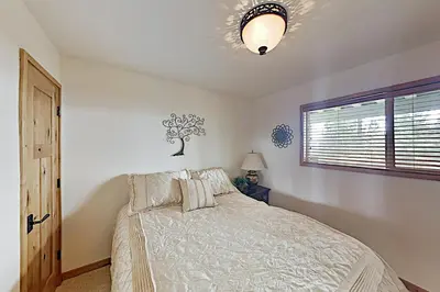 a bedroom with a bed and a window at Bitterbrush 25 in Incline Village