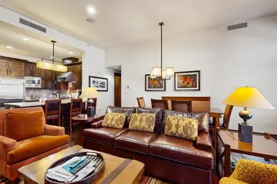 a living room with a couch and a table at Northstar Lodge Luxury in Kingswood Estates