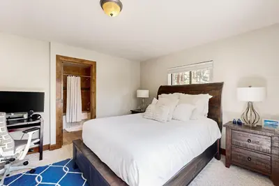 a bedroom with a large bed with a desk and a computer at Tyner Dreams in Incline Village