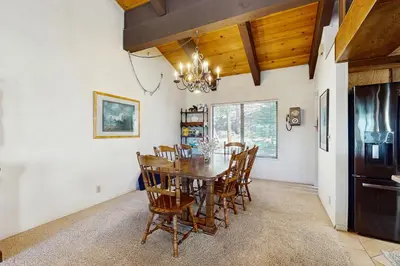 a dining room with a table and chairs at Katherine Court Townhouse in Stateline
