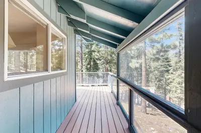 a house with a balcony with windows and a deck at Lake View Escape in Incline Village