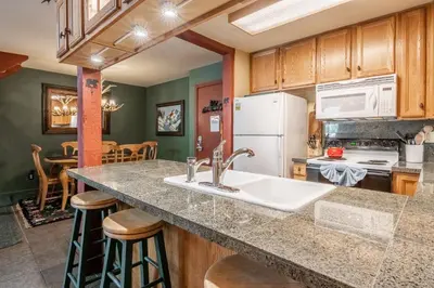 a kitchen with a sink and a counter top at New Listing 2 bedroom and Loft 2 bath Summit E Bldg 12 condo sleeps 8 Steps to Eagle Lodge Chair 15 in Mammoth Lakes