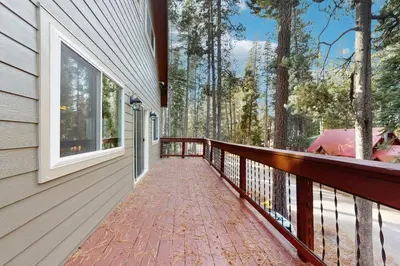 a balcony of a house with a walkway at Conifer Donner in Truckee