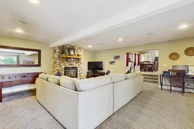 a living room with a couch and a fireplace at Skyline Manor in South Lake Tahoe
