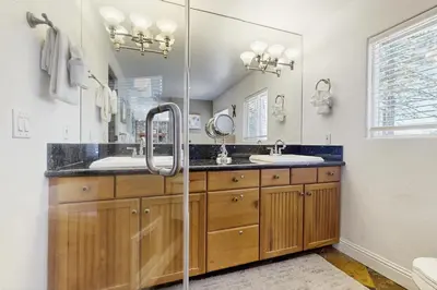a bathroom with two sinks and a shower at Skyline Manor in South Lake Tahoe